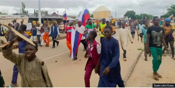 Nigerians protesting with Russian flag