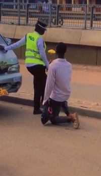 TikToker presenting the flowers to the police officer