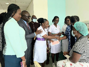 Management of Ridge Hospital presenting GH¢800 and a mobile phone to the assaulted nurse