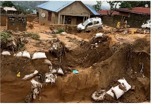 Damage inflicted after heavy rains caused floods and landslides