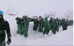 Rescuers carry workers after avalanche near Mana village in Chamoli district of India's Uttarakhand