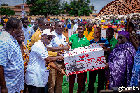North Member of Parliament, Dr Gideon Boako presenting the items to some of the beneficiaries
