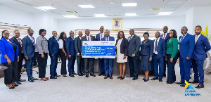 The Ghana EXIM Bank team with their dummy cheque for the MahamaCares initiative