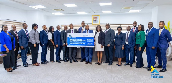 The Ghana EXIM Bank team with their dummy cheque for the MahamaCares initiative