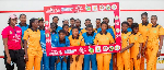 The cricket players in a group photo after the event