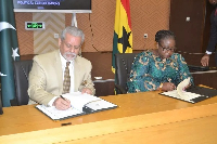 Khadija Iddrisu (right) and Hamid A. Khan during the signing of the MoU