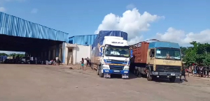 Some trucks at an axle weighing station