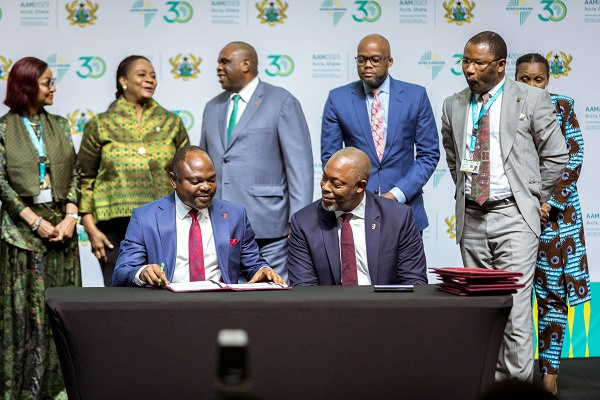 Muyiwa Akinyemi Group DMD of UBA signing the PAPSS MOU.