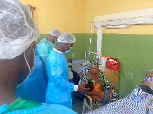 Minister of Health, Kwabena Mintah Akandoh interacting with a patient