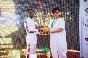 Saaka Nicholas receiving his award