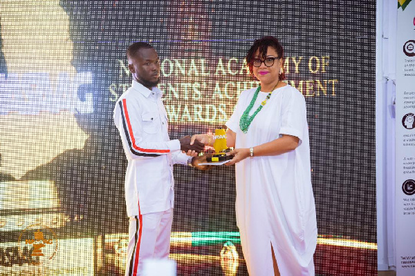 Saaka Nicholas receiving his award