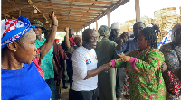 Chairman COKA exchanging pleasantries with some traders