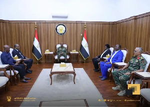 Kwasi Appiah seated with President of Sudan Abdel Fattah Al-Burhan