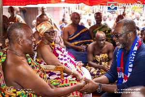 NAPO (right) exchanging pleasantries with the Juabenhene