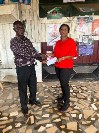Dr Grace Ayensu-Danquah making a donation