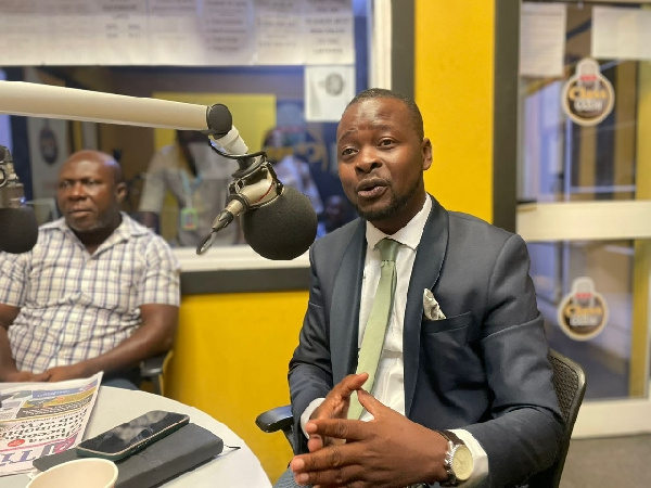 WhatsUP editor David Tamakloe (in suit) with editor of The Finder newspaper Elvis Darko