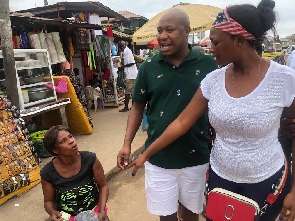 Horace Ekow Ewusi with some market women | File photo