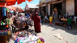 Traders sell their wares along a street in Somalia