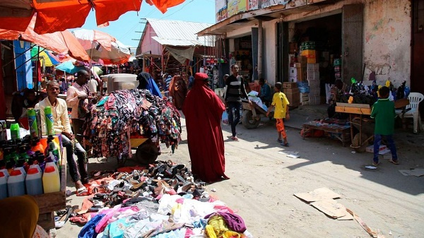 Traders sell their wares along a street in Somalia