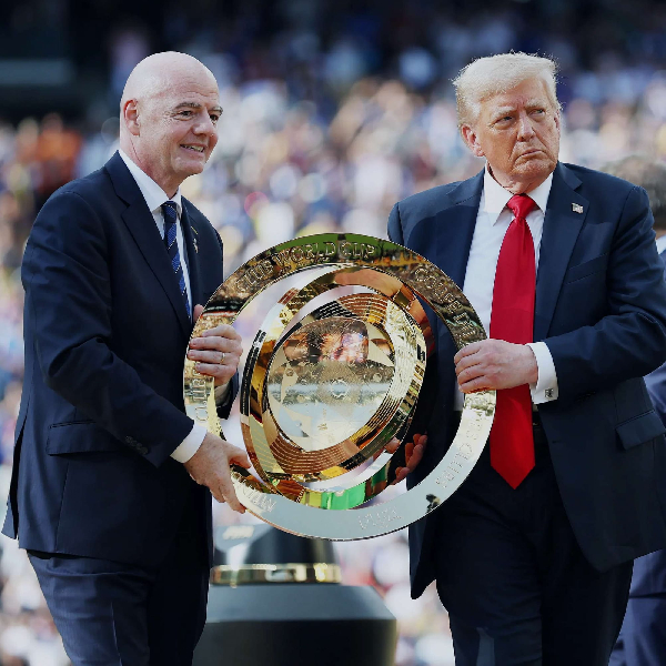 Gianni Infantino (L) and Donald Trump (R) holding the Club World Cup trophy