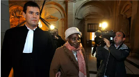 Former Rwandan first lady, Agathe Habyarimana, centre, arrives at Paris courthouse, 10 January 2012
