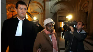 Former Rwandan first lady, Agathe Habyarimana, centre, arrives at Paris courthouse, 10 January 2012