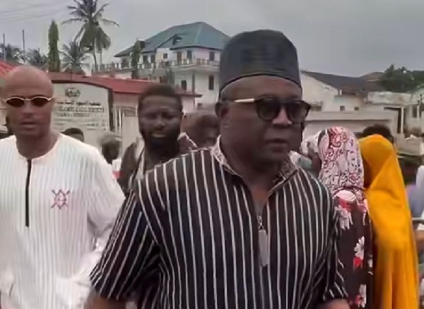 Abedi Pele (R) and his son Dede Ayew (L) walking to the mosque