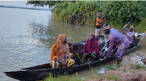 People get on a handmade wooden boat