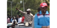 Chadema's national Chairman Freeman Mbowe flashes a V-sign on his way to the Furahisha Grounds