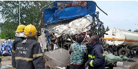 The wreckage of the fuel tanker and a Fuso truck that collided head-on