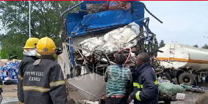 The wreckage of the fuel tanker and a Fuso truck that collided head-on