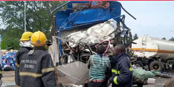 The wreckage of the fuel tanker and a Fuso truck that collided head-on