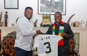 Asamoah Gyan and President Emmerson Dambudzo Mnangagwa