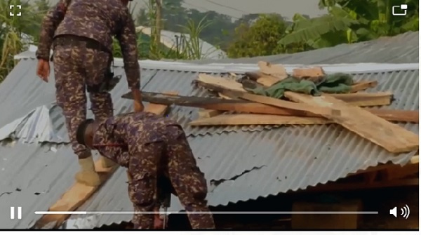 Police officers destroying some 'wee ghettos at Bibiani municpality