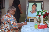 Gifty Afenyi-Dadzie signing the book of condolence