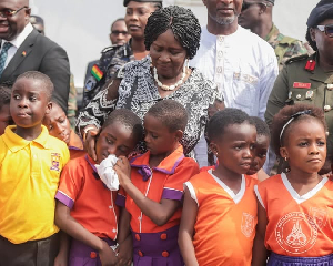 Prof Naana Jane comforting the school pupil who was overwhelmed with emotion