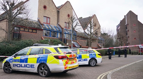 Police officers are pictured at the scene of the incident on Tuesday.