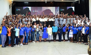 Executives captured in a photo with some students