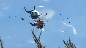 Helicopters battle wildfires in Greece moments before colliding