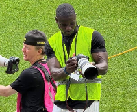 Former Black Stars defender Jonathan Mensah (dark in complexion)  is a photographer