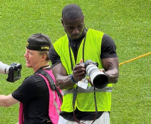 Former Black Stars defender Jonathan Mensah (dark in complexion)  is a photographer