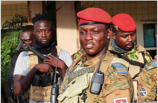 Burkina Faso's military leader Ibrahim Traore being escorted by soldiers