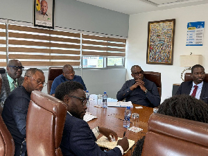 Sylvester Mensah (head of the table) with the AfDB team during their engagements