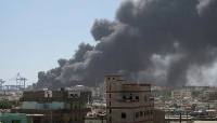 Smoke billows after a drone attack on the port of Port Sudan on May 6, 2025