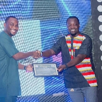 Kofi Atta Kakra Kusi (right) receiving his honorary award