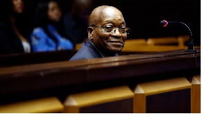 Former South African president Jacob Zuma sits in the dock of the High Court of Pietermaritzburg