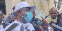 A photo of Joseph Annang adressing the media