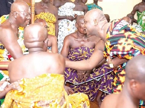 Addai-Nimoh (right) greets the Asantehene