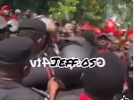 Watch as 'angry' Afenyo-Markin knocks police officer's head during demo