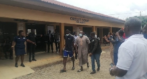 The suspects being led away from the court into custody